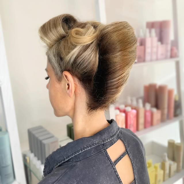 Sculpted blonde occasion updo photographed at Carole Graf Hair