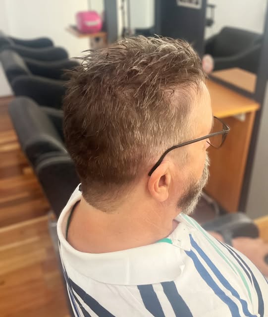 Men's short haircut with textured hair on top