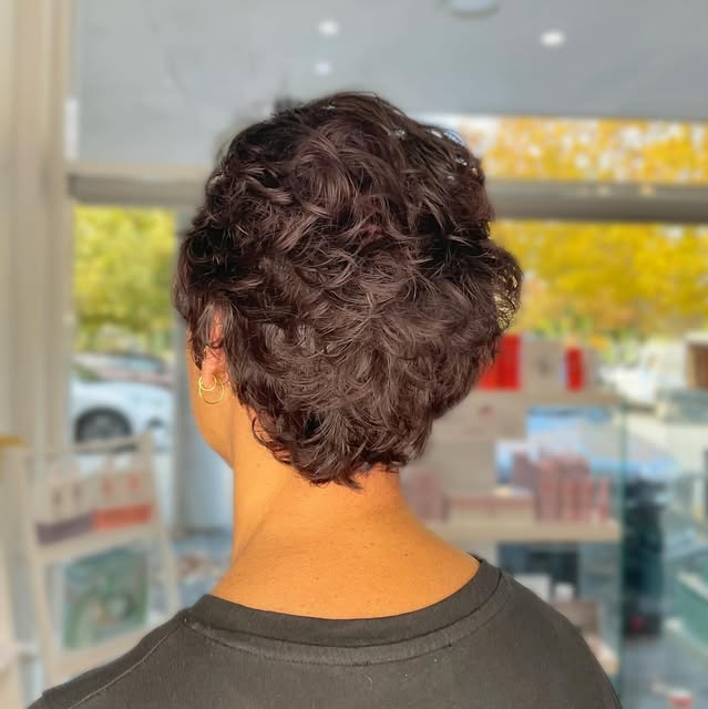 Short brunette hair with textured curls