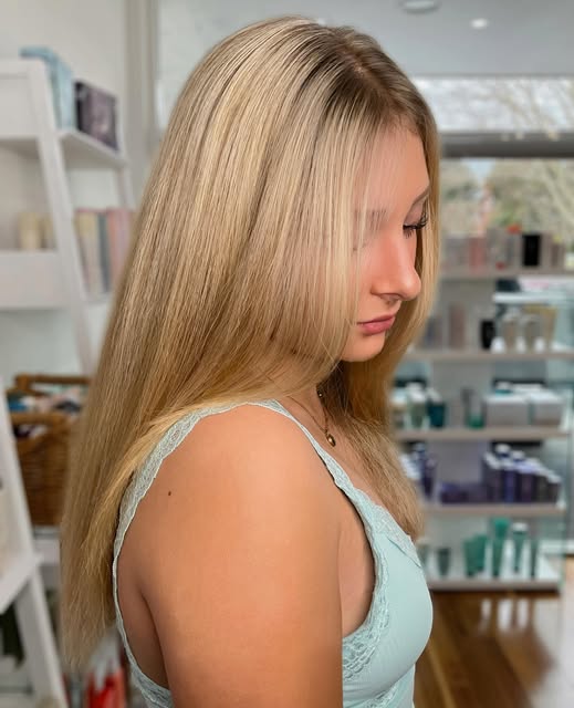 Long, softly layered blonde hair