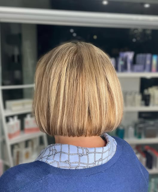 A neatly shaped blonde bob, viewed from the back