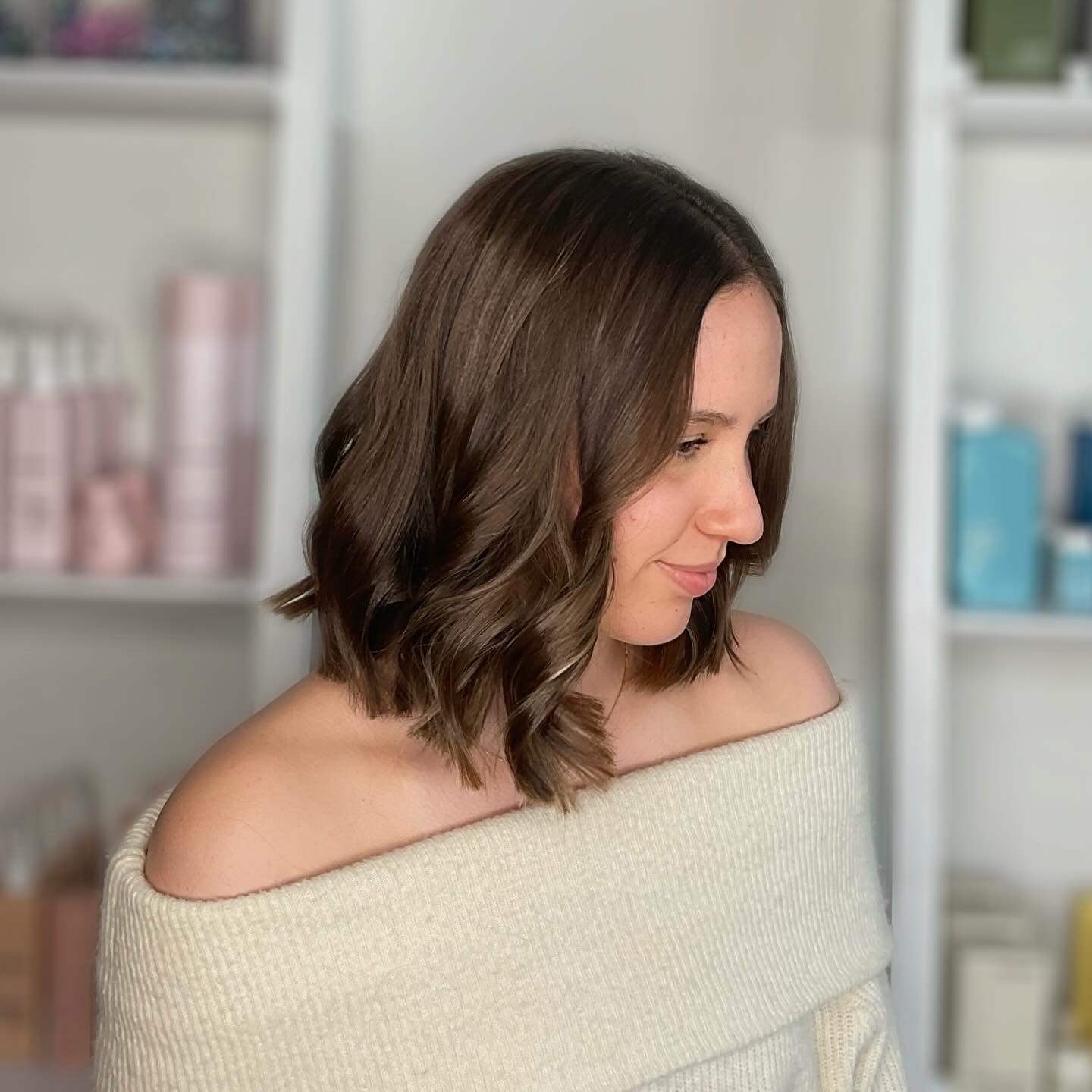 Soft brunette waves in a shoulder-length bob, styled by Brooke at Carole Graf Hair